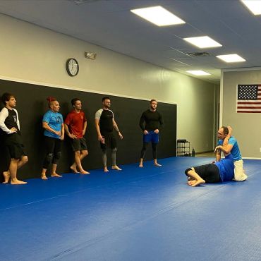 Professor Stockton The Gremlin teaching a kimura in nogi class
