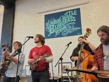 A bluegrass band performing indoors.