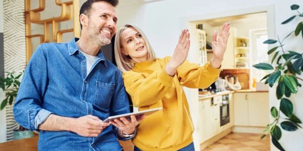 Homeowners discussing interior painting ideas with Fresh Paint FL professionals in Central Florida