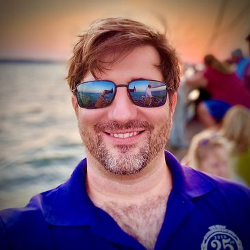 G. Scott Shaw, on the Schooner Woodwind at sunset on his mother, Twinkle’s, 70th Birthday.