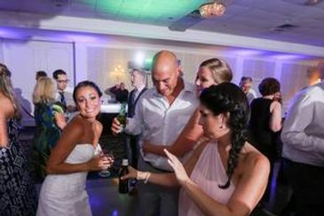 A group of people drinking at a wedding