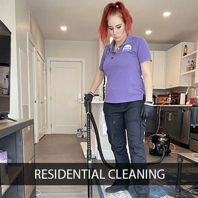 A woman doing residential cleaning of a home