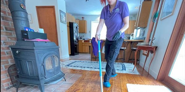 A woman cleaning the floor