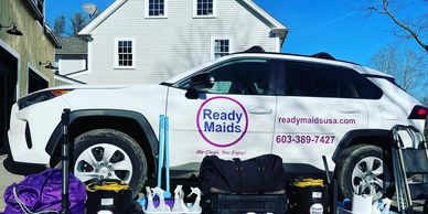 Ready Maids official car with cleaning supplies