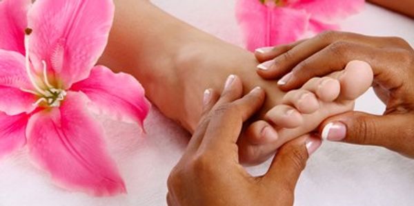 <img alt>foot massage with pink flowers