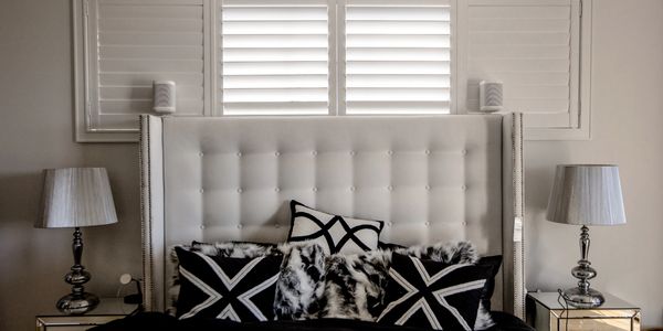 Shutter Force white plantation shutters in bedroom