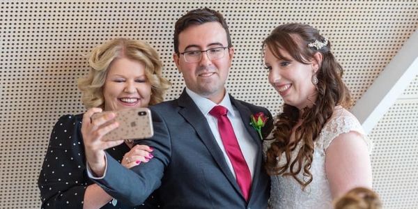 Selfie photo of Lizz Edwards Canberra Celebrant with a bride and groom.