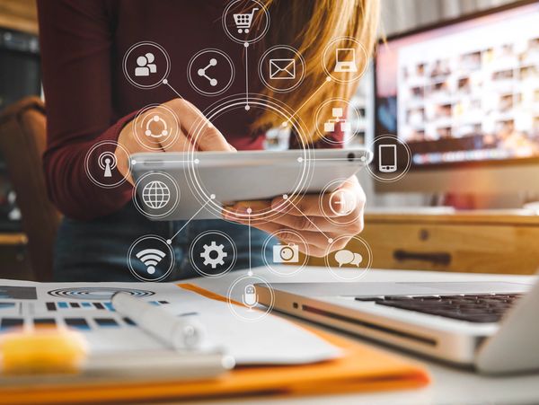 marketing startup owner hand working with laptop, tablet and smartphone in office with virtual icons