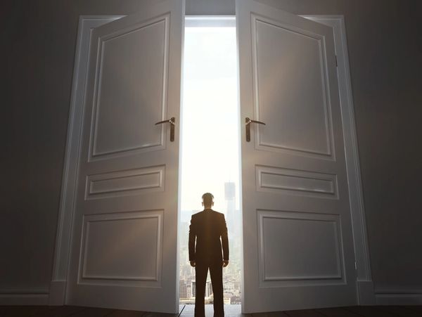Startup Marketing founder in room with big door in town
