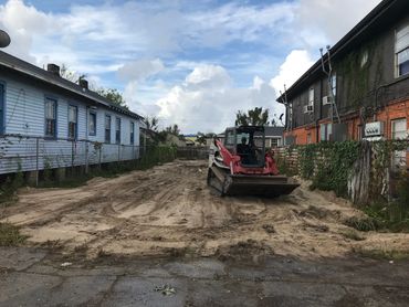 Residential Lot clearing of debris and leveling the yard and dirt spreading for foundation