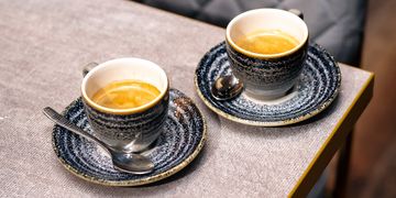 Two Tea Cups on a Grey Color Table