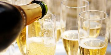 Champaign Being Poured onto Champaign Glasses