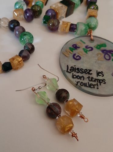 photo of beaded necklace, bracelet and earrings made of resin beads