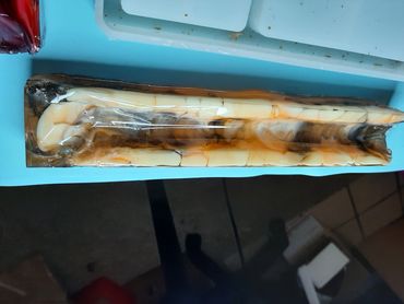 photo of resin incense holder in marbled black, white, and orange