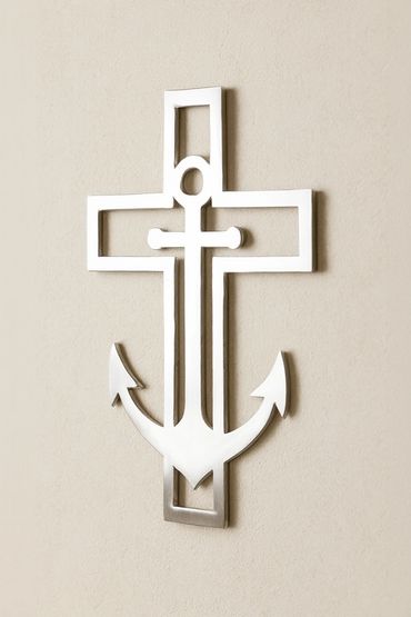 Metal wall art combining a cross and an anchor.