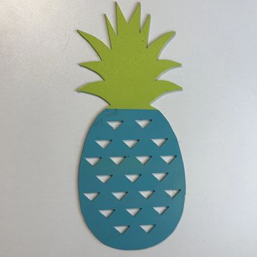 Blue and green stylized pineapple cutout on white background.