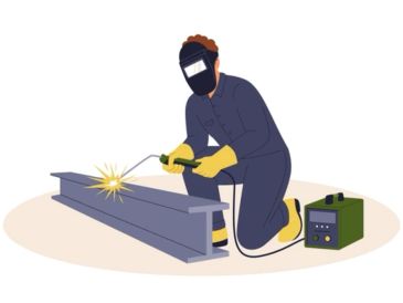 Person welding metal beam with protective gear.
