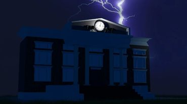 A courthouse during a lightning strike shot from outside the building.