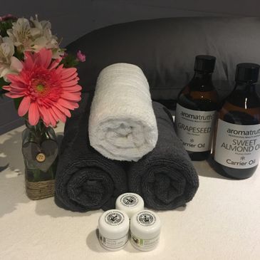 Towels and Massage Therapy oils and creams.
