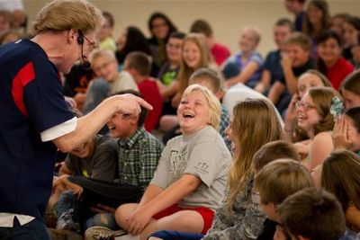 Children's book author Daryl Cobb performing during an author visits program.