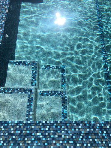 Shout out to Mid-West Plastering LLC, the pebble looks beautiful.