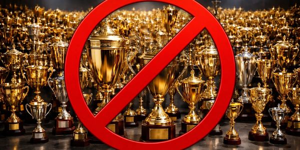 Numerous trophies behind a red prohibition symbol indicating no awards.