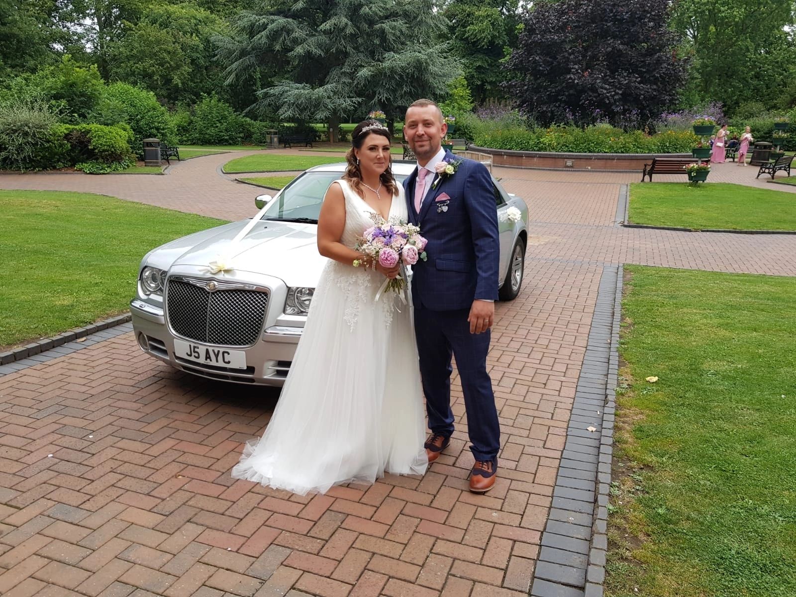This Happy Couple, pictured with our silver Chrysler at West Bridgford Registry Office.