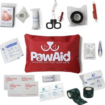 Pet first aid kit with supplies and red pouch.