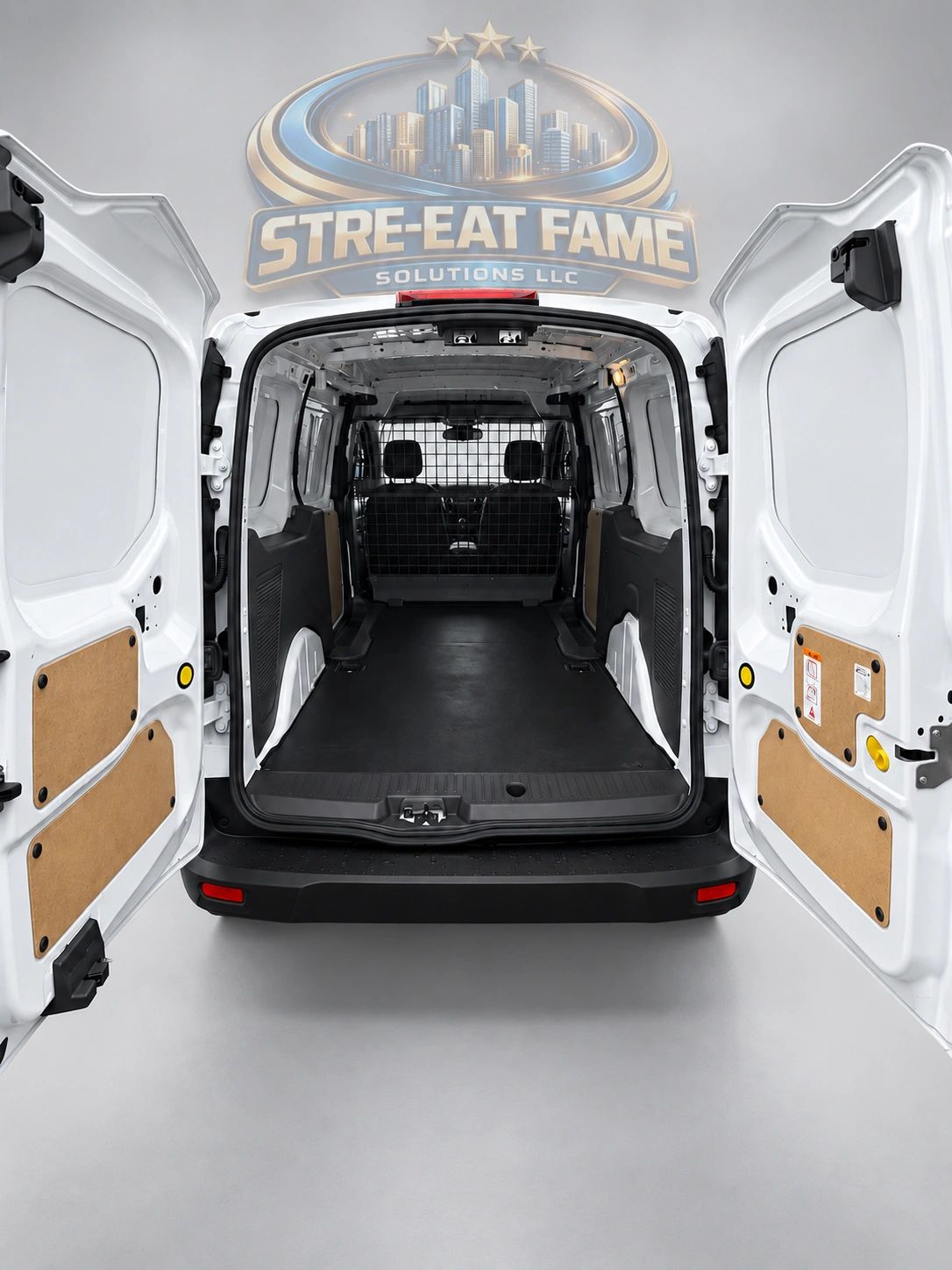 Empty white cargo van interior with open rear doors.