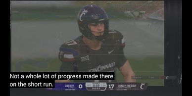 Cincinnati football player during a game against Liberty with a score of 17-0.