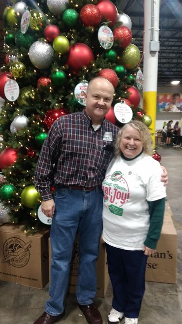 Derek and Charlotte Tilley in front of the Christmas tree @ Samaritan's Purse "Operation Christmas C
