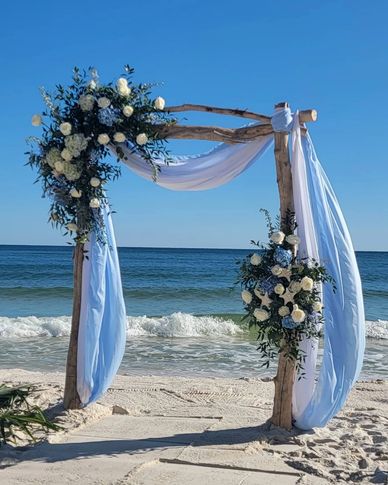 Cream colored driftwood arch. wedding arch rentals. ceremony rental Orange Beach and Gulf Shores, Al