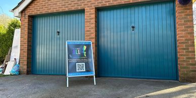 garage door resprayed in peacock blue