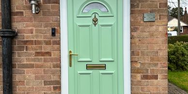 front door sprayed in pale green