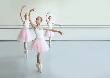 girls wearing pointe shoes