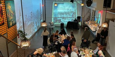 Photo from Mezzanine Showing Visuals on Walls at Party in The Fish Tank Event Venue in Dana Point