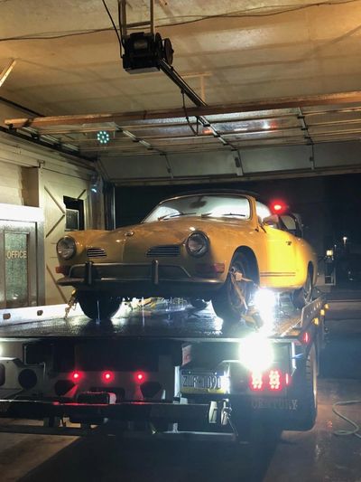 Karman Ghia on the rollback Bed of Kelly Towing in Scranton Pa 
