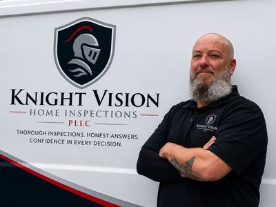 Man standing confidently next to Knight Vision Home Inspections van.