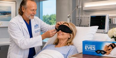 Doctor fitting patient with comfort eye mask in hospital.