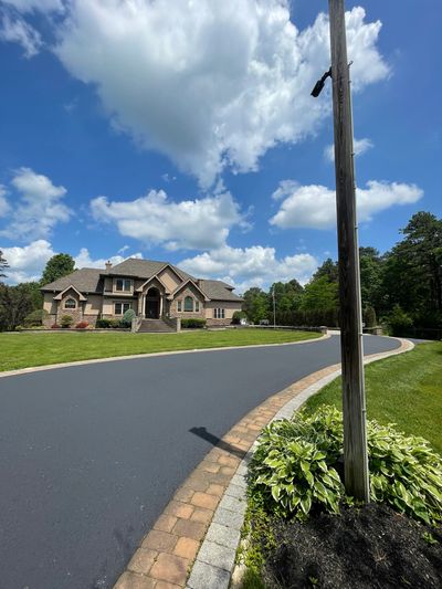 Beautiful asphalt driveway sealcoated