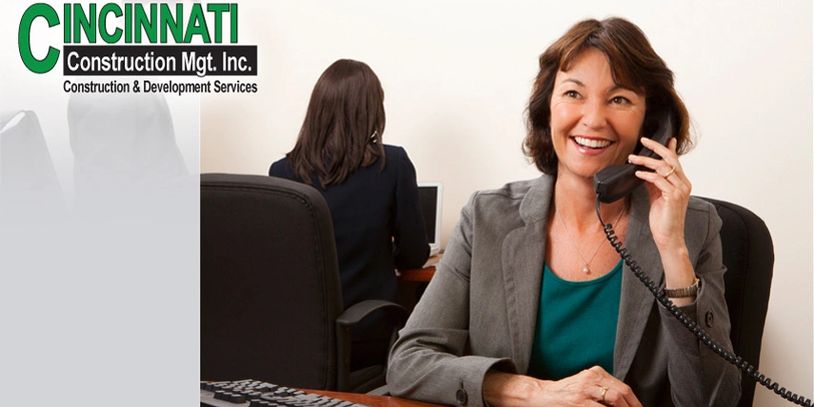 A woman talking on the Telephone in the office