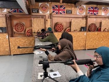 people learning how to shoot air rifles at white wolf activity centre Hudderfield