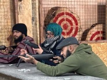 people learning how to shoot air rifles at white wolf activity centre Hudderfield