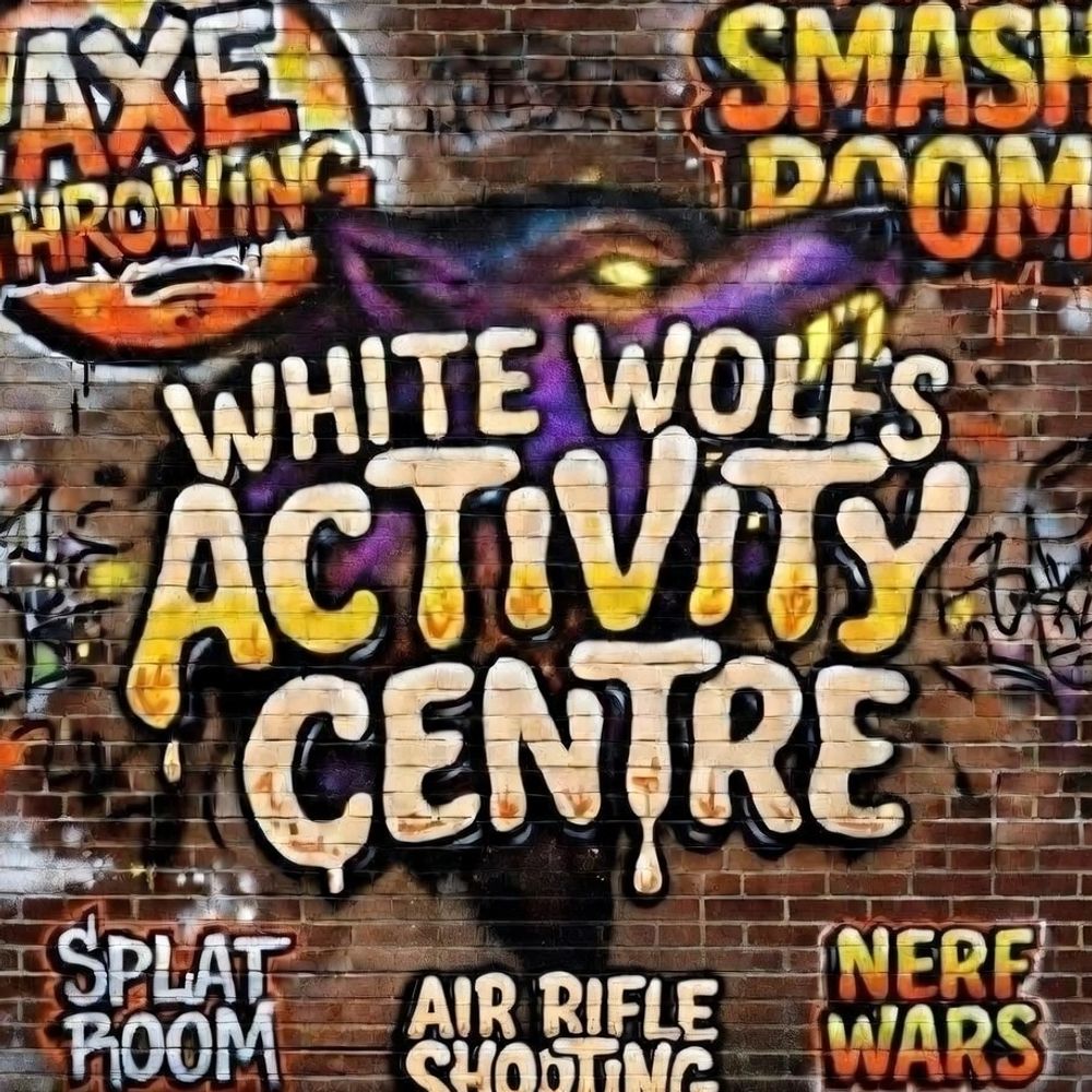 Indoor axe throwing lanes with targets and British flags.