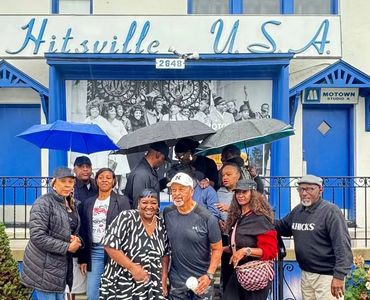 Group of people gathered in front of Hitsville U.S.A. building.