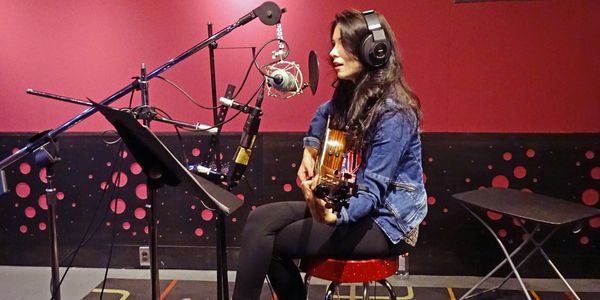 Lilly MacPhee in studio recording for Giving Songs