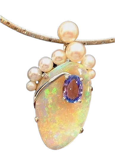 18kt White Gold Pendant 
set with South Sea Pearls, Tanzanite & an Opalized Clam Shell