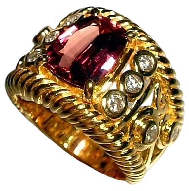 An 18kt Yellow Gold Ring
set with Diamonds & an Iron Red Sapphire