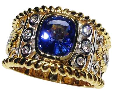 An 18kt White & Yellow Gold Ring
set with Diamonds
& a Blue Sapphire