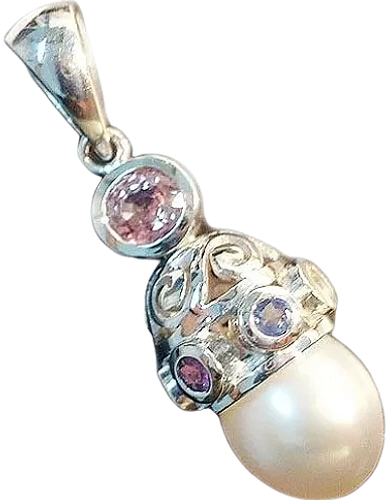 18kt White Gold Pendant
set with Spinel & a South Sea Pearl